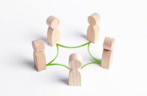 Circle of people interconnected by curves lines. cooperation, teamwork, training. Collaboration and cooperation, participation. Social connections, joining to solve tasks. Staff, community meeting